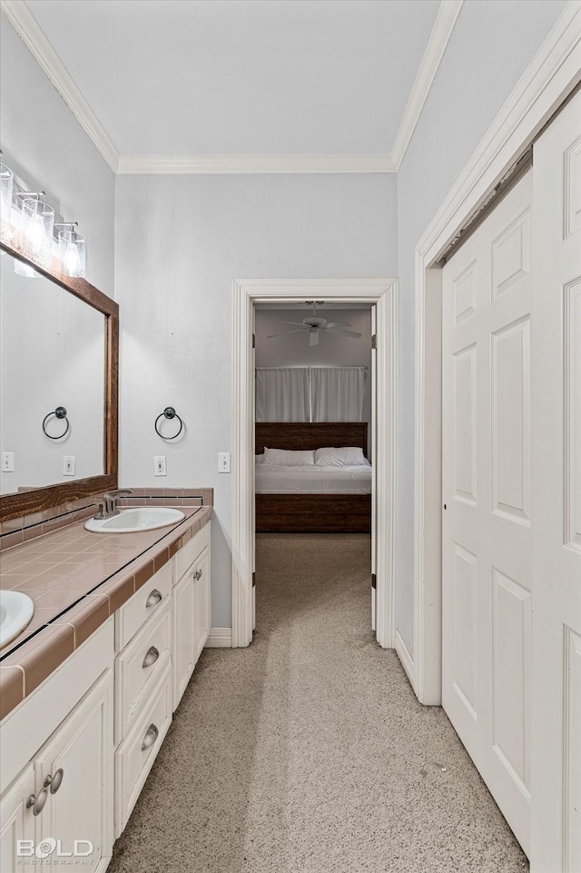 4013 Wisteria Ln, Benton, LA 71006 - bathroom featuring carpet floors, crown molding, baseboards, double vanity, and connected bathroom