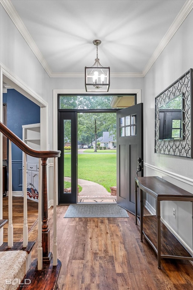 4013 Wisteria Ln, Benton, LA 71006 - foyer entrance with wood finished floors, a chandelier, healthy amount of natural light, ornamental molding, and stairs