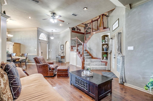 1201 W Buffalo Trl, Joshua, TX 76058 - living area with stairs, a ceiling fan, wood finished floors, a towering ceiling, and ornamental molding