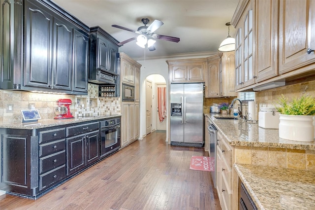 1201 W Buffalo Trl, Joshua, TX 76058 - kitchen featuring black appliances, ceiling fan, arched walkways, light stone countertops, and decorative backsplash