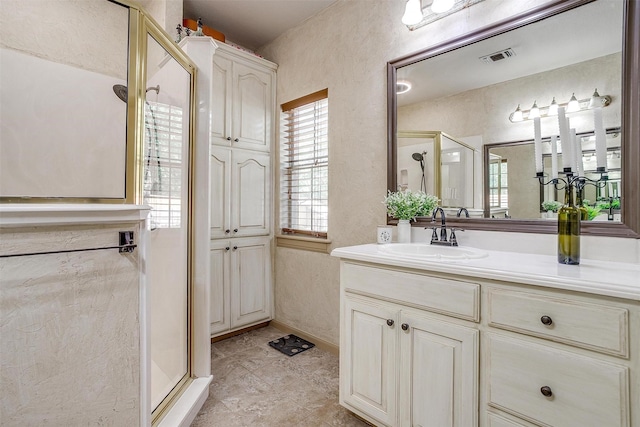 1201 W Buffalo Trl, Joshua, TX 76058 - bathroom with a stall shower, a textured wall, and vanity