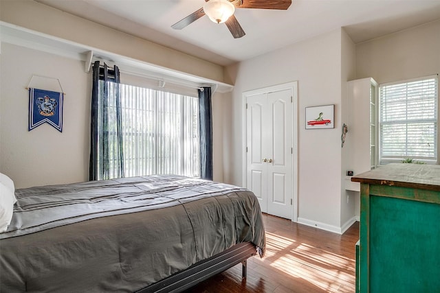 1201 W Buffalo Trl, Joshua, TX 76058 - bedroom with wood finished floors, baseboards, a ceiling fan, and a closet