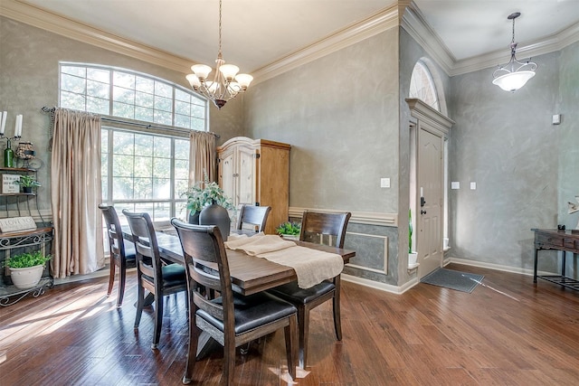 1201 W Buffalo Trl, Joshua, TX 76058 - dining area featuring dark wood-type flooring, a high ceiling, a chandelier, and crown molding