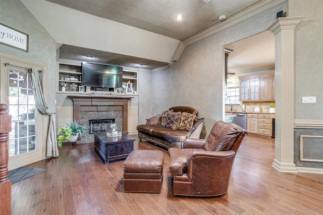 1201 W Buffalo Trl, Joshua, TX 76058 - living room with a glass covered fireplace, ornamental molding, wood finished floors, and ornate columns