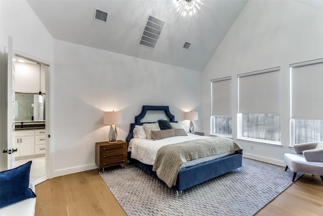 2228 Sandrellan St, Fort Worth, TX 76008 - bedroom featuring light wood-type flooring, high vaulted ceiling, baseboards, and ensuite bathroom