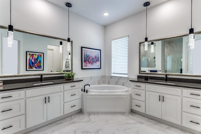 2228 Sandrellan St, Fort Worth, TX 76008 - bathroom with marble look tile flooring, a marble finish shower, two vanities, a bath, and recessed lighting