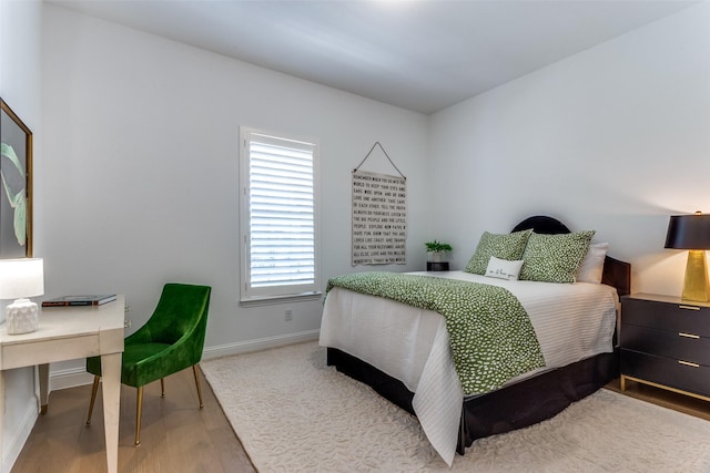 2228 Sandrellan St, Fort Worth, TX 76008 - bedroom with wood finished floors and baseboards