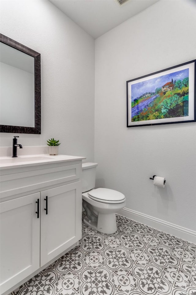 2228 Sandrellan St, Fort Worth, TX 76008 - bathroom featuring toilet, vanity, and baseboards