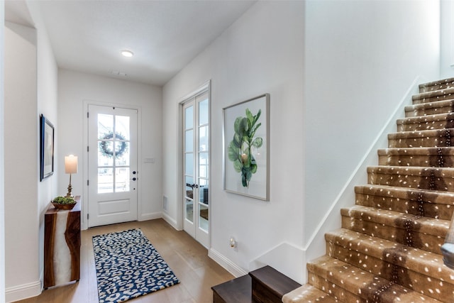 2228 Sandrellan St, Fort Worth, TX 76008 - foyer entrance with stairway, wood finished floors, baseboards, and french doors