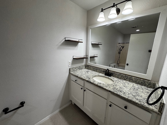 2910 Raintree Dr, Plano, TX 75074 - bathroom with tile patterned floors, vanity, baseboards, and toilet