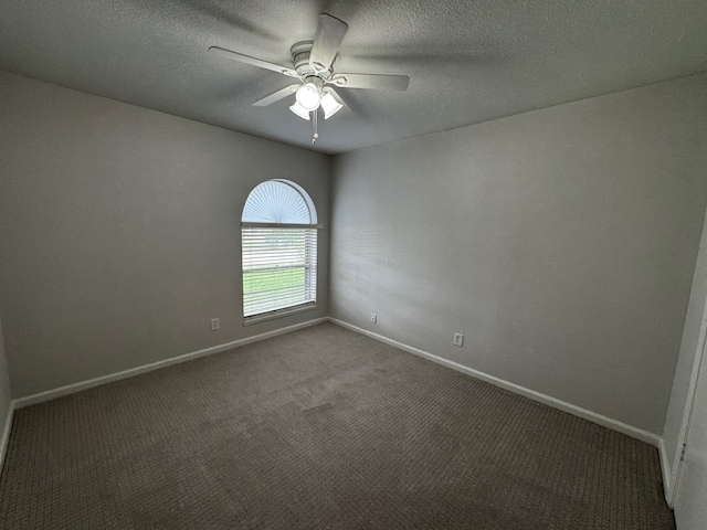 2910 Raintree Dr, Plano, TX 75074 - carpeted spare room featuring ceiling fan, baseboards, and a textured ceiling