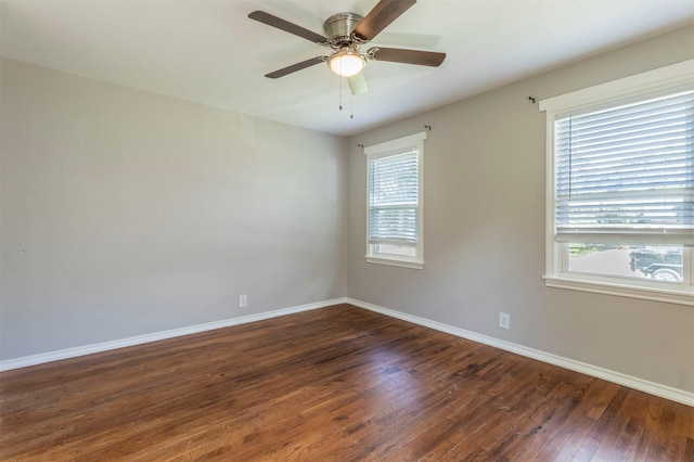 1610 Florence St, Arlington, TX 76010 - unfurnished room featuring dark wood-type flooring, baseboards, and a ceiling fan