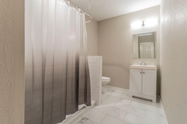 1610 Florence St, Arlington, TX 76010 - bathroom featuring marble finish flooring, baseboards, a shower with shower curtain, and vanity