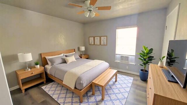 1107 Beech S, Bonham, TX 75418 - bedroom with cooling unit, wood finished floors, and baseboards