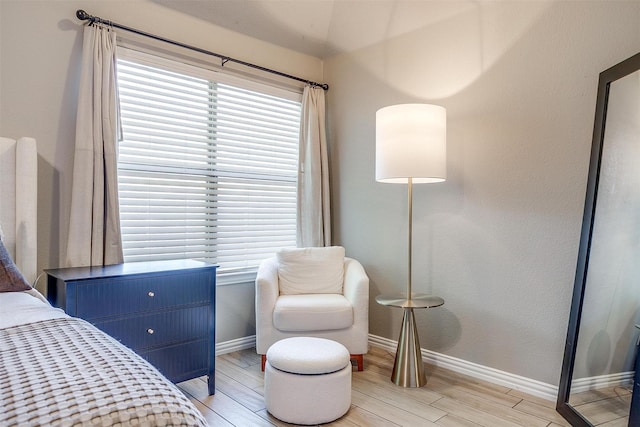 bedroom featuring baseboards and light wood-type flooring