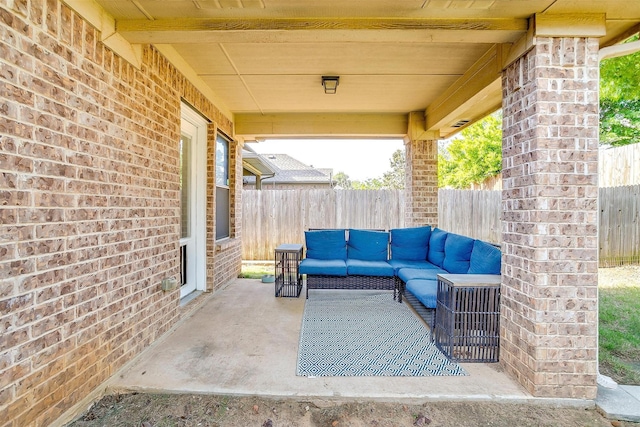 view of patio with an outdoor living space and a fenced backyard
