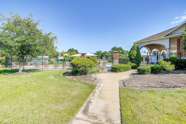 view of yard featuring a community pool