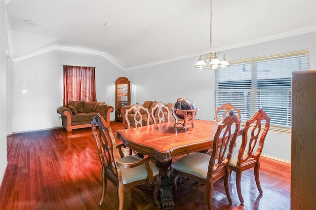 8115 Guadalupe Rd, Arlington, TX 76002 - dining space with lofted ceiling, a chandelier, wood finished floors, crown molding, and baseboards
