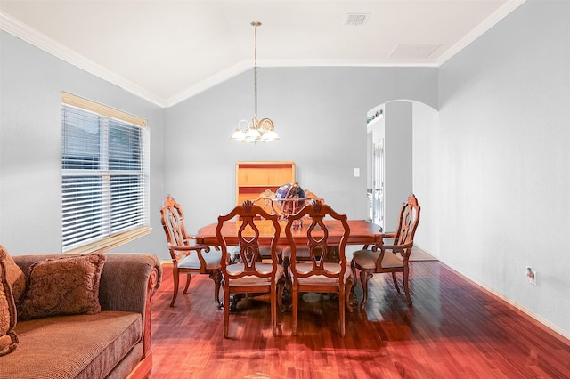 8115 Guadalupe Rd, Arlington, TX 76002 - dining room featuring arched walkways, ornamental molding, wood finished floors, vaulted ceiling, and baseboards