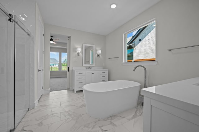 11549 Wulstone Rd, Fort Worth, TX 76052 - bathroom featuring marble look tile flooring, vanity, a freestanding tub, a stall shower, and recessed lighting