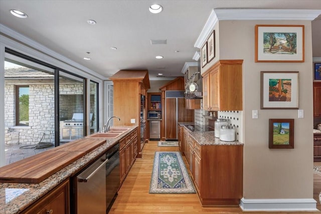 201 Jenkins Rdg, Aledo, TX 76008 - kitchen with a sink, light wood-type flooring, built in appliances, light stone counters, and decorative backsplash