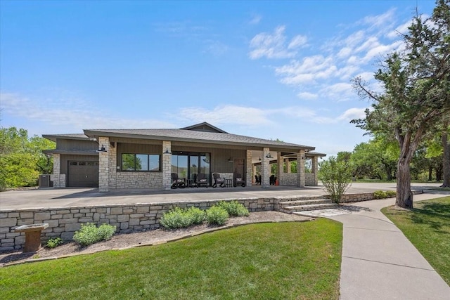 201 Jenkins Rdg, Aledo, TX 76008 - back of property with an attached garage, a yard, and stone siding
