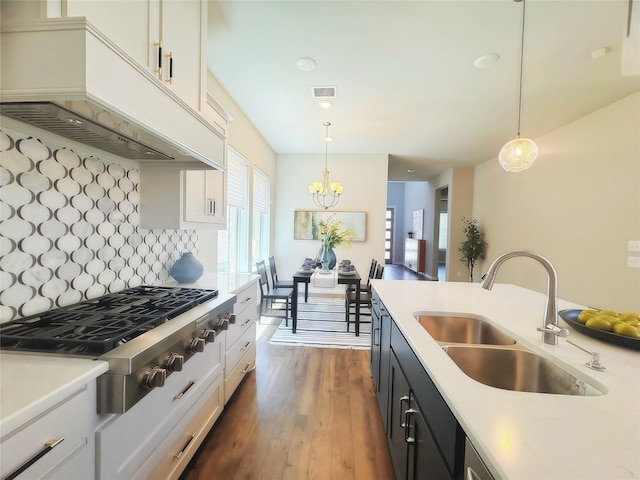 1002 Kennedy Dr, Allen, TX 75013 - kitchen featuring a sink, custom range hood, stainless steel gas cooktop, and light countertops