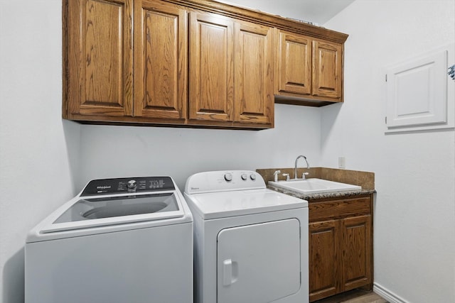 2210 Ridgewood Dr, Bridgeport, TX 76426 - washroom with washer and clothes dryer and cabinet space