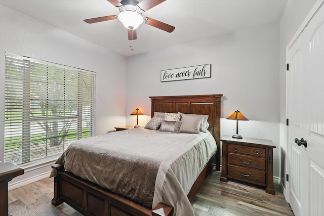 2210 Ridgewood Dr, Bridgeport, TX 76426 - bedroom with wood finished floors, baseboards, and ceiling fan