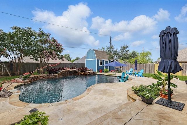 2210 Ridgewood Dr, Bridgeport, TX 76426 - view of swimming pool with a fenced backyard, a patio area, and an outdoor structure