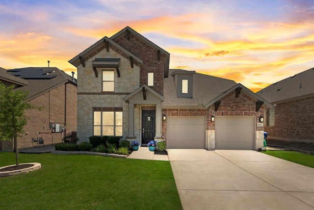 3594 Dover Dr, Mckinney, TX 75069 - view of front of house featuring stone siding, brick siding, concrete driveway, and a front lawn