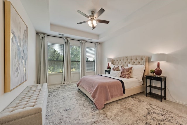 3594 Dover Dr, Mckinney, TX 75069 - bedroom with baseboards, carpet flooring, a tray ceiling, and a ceiling fan