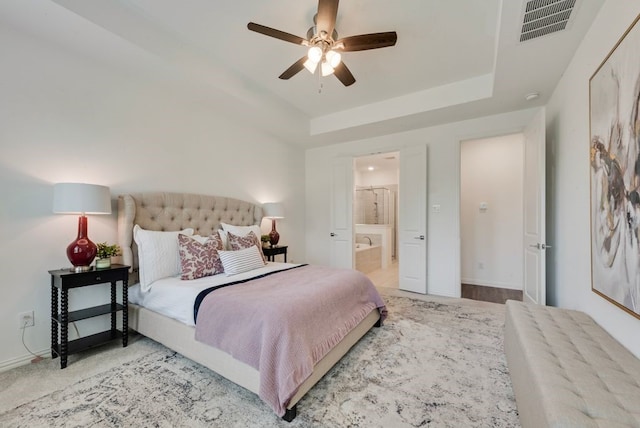 3594 Dover Dr, Mckinney, TX 75069 - bedroom with a tray ceiling, ensuite bathroom, baseboards, and a ceiling fan