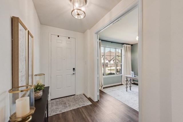 3594 Dover Dr, Mckinney, TX 75069 - foyer with dark wood-type flooring and baseboards
