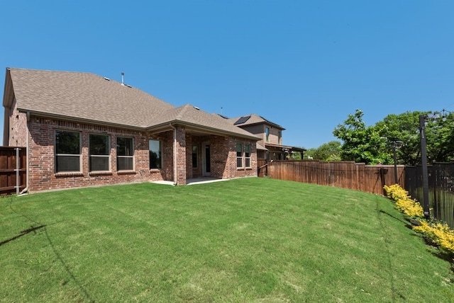 3594 Dover Dr, Mckinney, TX 75069 - back of house with brick siding and a shingled roof