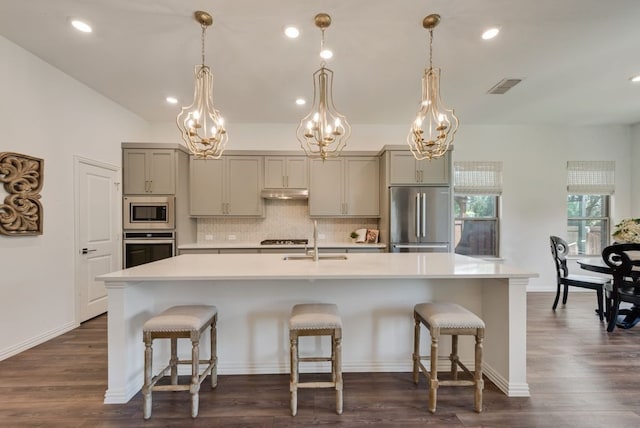 3594 Dover Dr, Mckinney, TX 75069 - kitchen featuring stainless steel appliances, a chandelier, gray cabinetry, light countertops, and recessed lighting