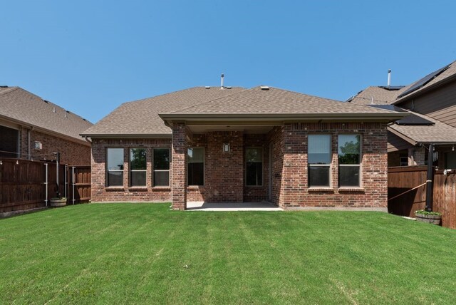 3594 Dover Dr, Mckinney, TX 75069 - back of property with brick siding, a patio, and a shingled roof