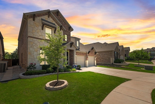 3594 Dover Dr, Mckinney, TX 75069 - view of front of home with concrete driveway, stone siding, brick siding, and an attached garage