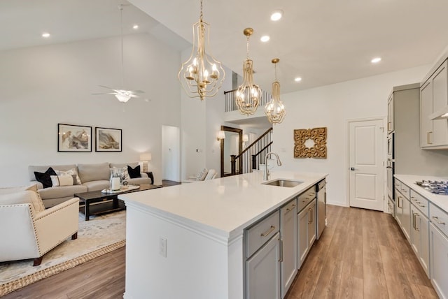 3594 Dover Dr, Mckinney, TX 75069 - kitchen featuring gray cabinetry, stainless steel appliances, a sink, ceiling fan, and light countertops