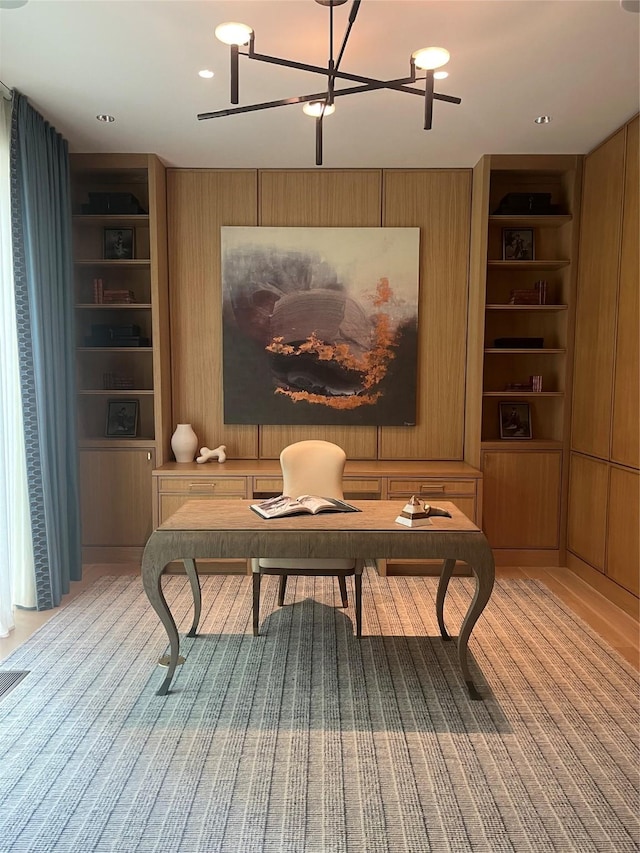 3906 Shenandoah St, Highland Park, TX 75205 - office area with built in features, wood walls, and a chandelier