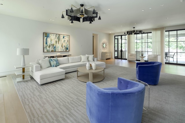 3906 Shenandoah St, Highland Park, TX 75205 - living room with a chandelier, wood finished floors, recessed lighting, and baseboards