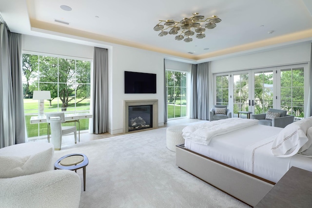 3906 Shenandoah St, Highland Park, TX 75205 - bedroom with french doors and a glass covered fireplace