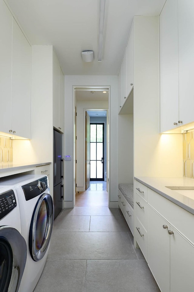 3906 Shenandoah St, Highland Park, TX 75205 - laundry area featuring washing machine and dryer and cabinet space