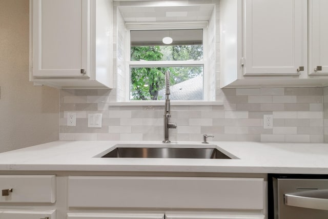 7300 Frances Ct, North Richland Hills, TX 76182 - kitchen featuring a sink, white cabinets, and backsplash