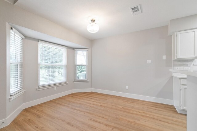 7300 Frances Ct, North Richland Hills, TX 76182 - unfurnished dining area with light wood finished floors and baseboards