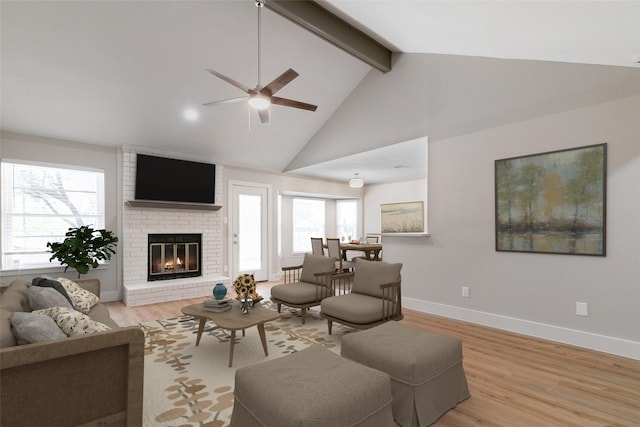 7300 Frances Ct, North Richland Hills, TX 76182 - living room featuring beam ceiling, ceiling fan, light wood-type flooring, a fireplace, and high vaulted ceiling