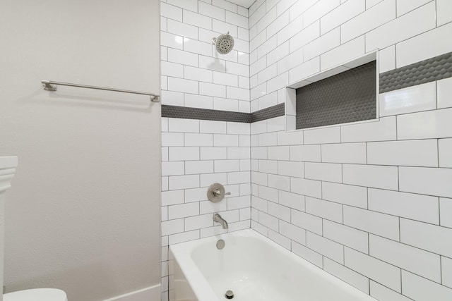7300 Frances Ct, North Richland Hills, TX 76182 - bathroom featuring bathing tub / shower combination, baseboards, and toilet