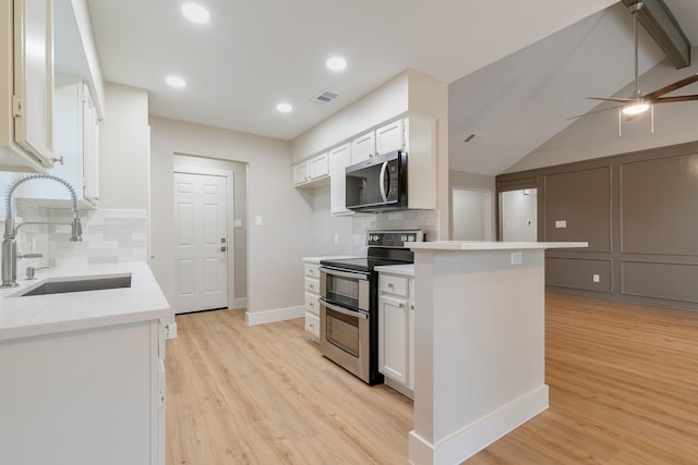 7300 Frances Ct, North Richland Hills, TX 76182 - kitchen featuring stainless steel appliances, a sink, tasteful backsplash, light wood finished floors, and recessed lighting