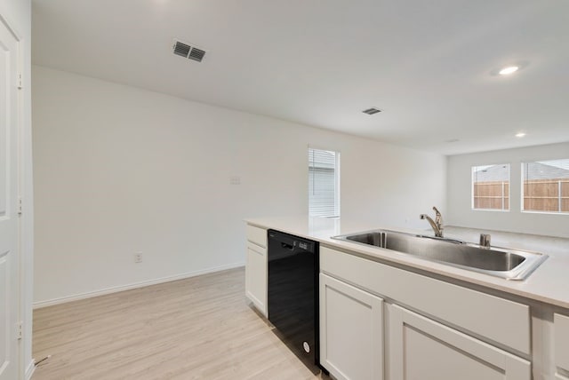 3310 Watterson Way, Crandall, TX 75114 - kitchen with dishwasher, a sink, light wood-style flooring, healthy amount of natural light, and recessed lighting