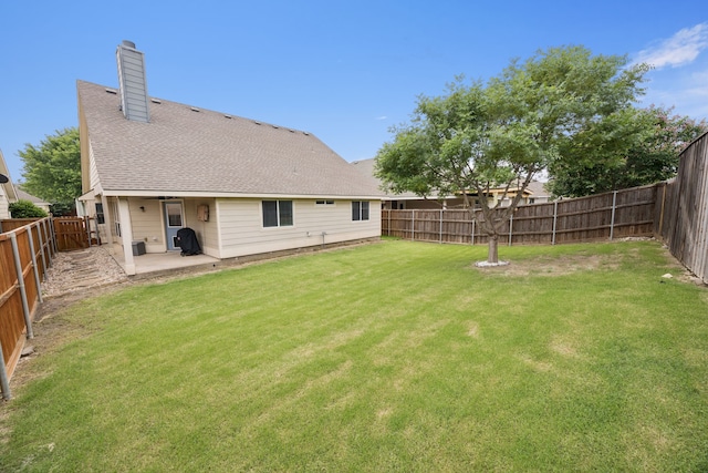9712 Hedge Bell Dr, Mckinney, TX 75072 - back of house featuring a patio area, a chimney, and a shingled roof
